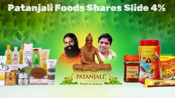 Image of Patanjali food products with Ramdev Baba and Balkrishn in the background, representing Patanjali Foods. Text at the top reads 'Patanjali Foods Shares Slide 4%.